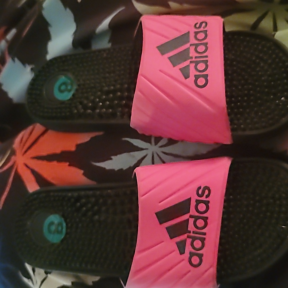 Pink amd black adidas slip on